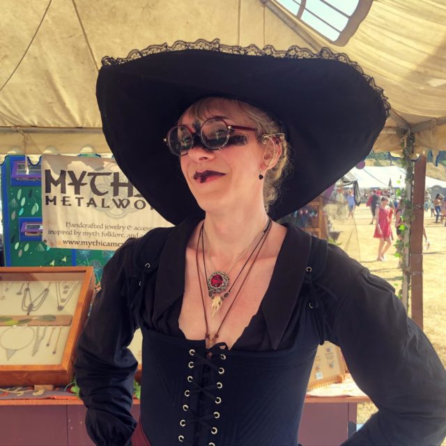 The lovely Bea selected this brilliant vintage red Swarovski crystal pendant to fit their witchy aesthetic. Magical amulet vibes! 🪄💎🧙🏻‍♀️One more weekend to go, Seattle area folks!
.
.
.
#washingtonmidsummerrenaissancefaire #renfaire #renaissancefaire #chainmaillejewelry #witchyvibes #handcrafted #handmadejewelry #artisan #shopsmall #magicaljewelry