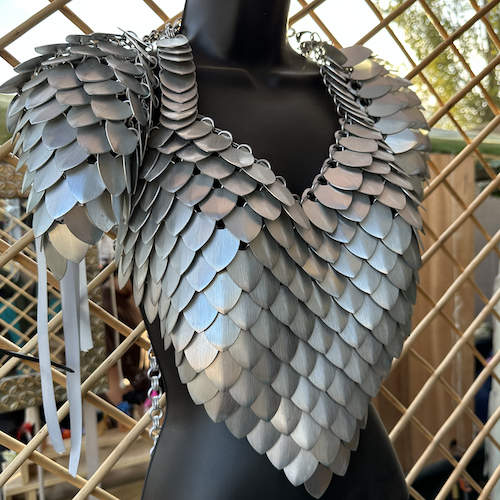 Silver color scalemaille armor top and shoulders on a mannequin